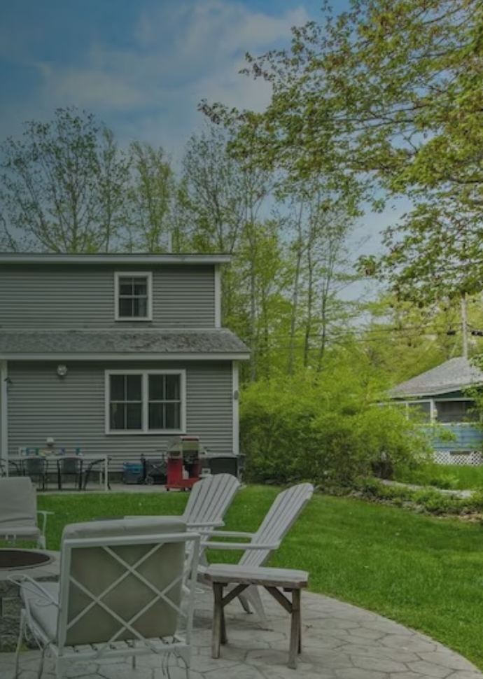 The private yard and outdoor chairs at Captain and the Kiwi in York, Maine